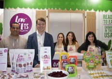 The team of Love Beets proudly show all the products they have on display.